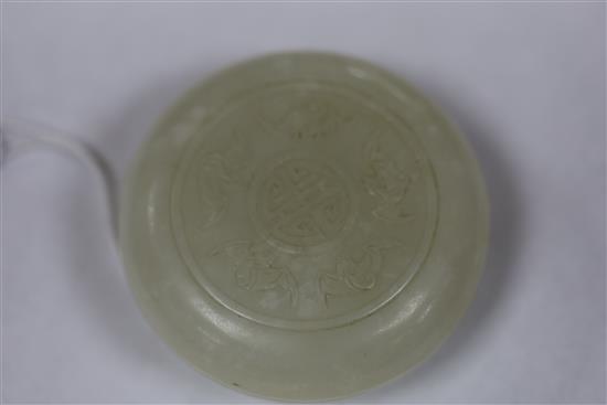 A Chinese white jade circular seal paste box, 18th/19th century, D. 6.5cm, wood stand